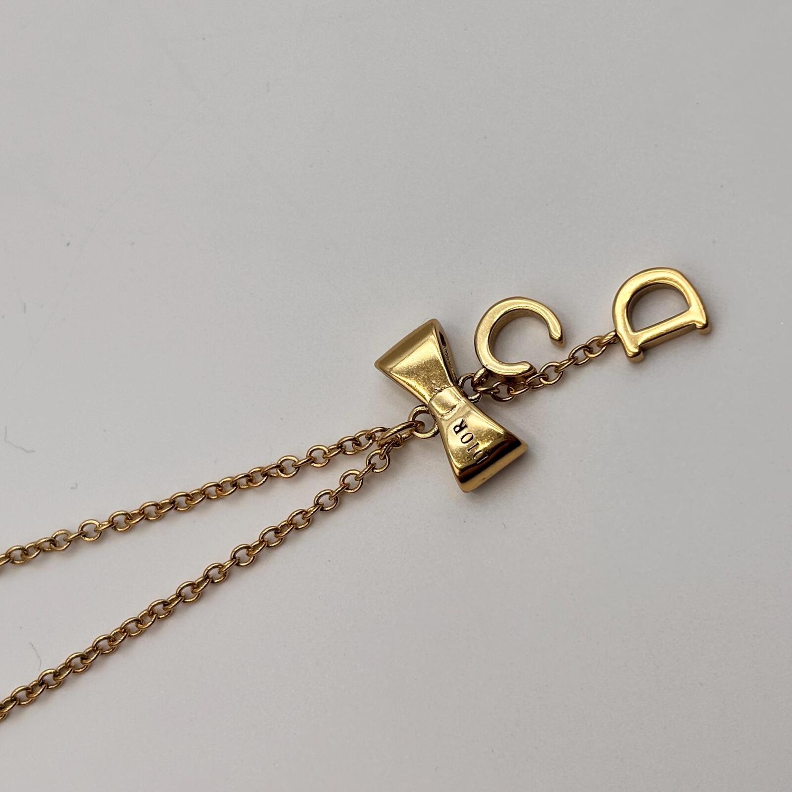 Christian Dior Gold Tone CD Bow Pendant Necklace