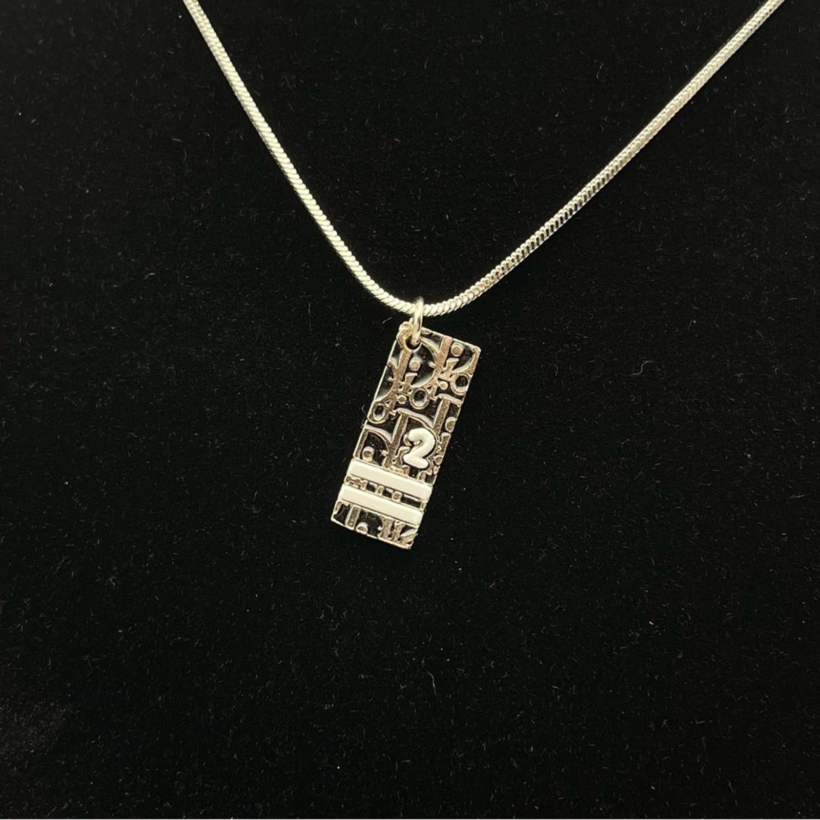 CHRISTIAN DIOR VINTAGE SILVER-TONE OBLIQUE / TROTTER PENDANT NECKLACE