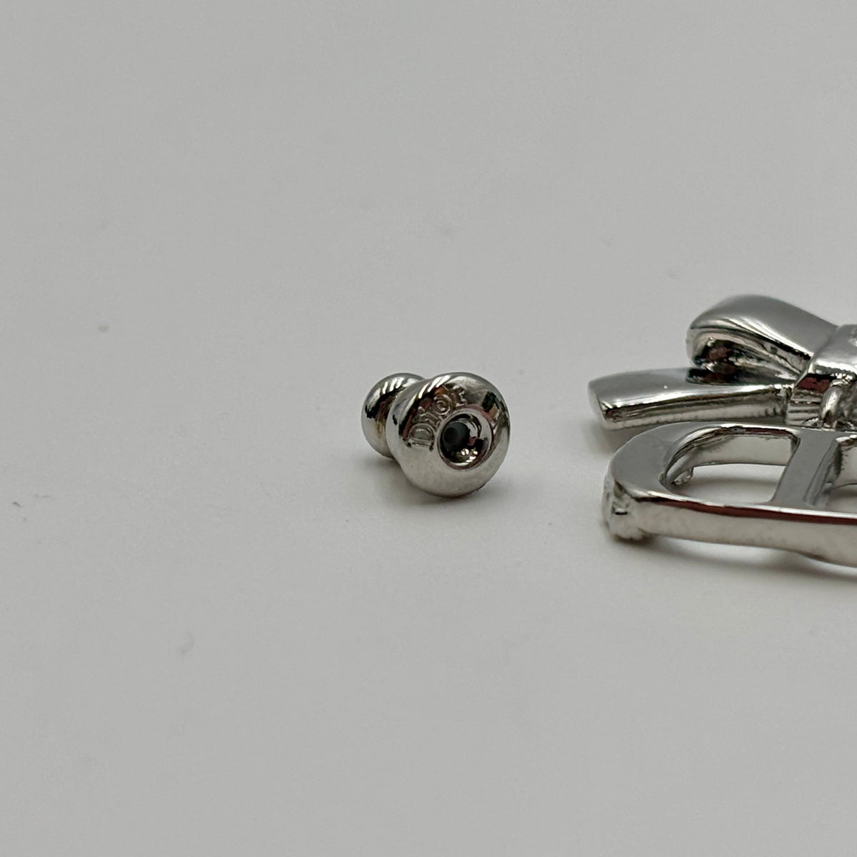 Dior CD Parure Asymmetric Bow Earrings in Silver