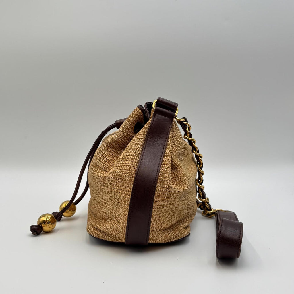 Chanel Raffia Drawstring Bucket Bag With Leather Trim & Gold Hardware