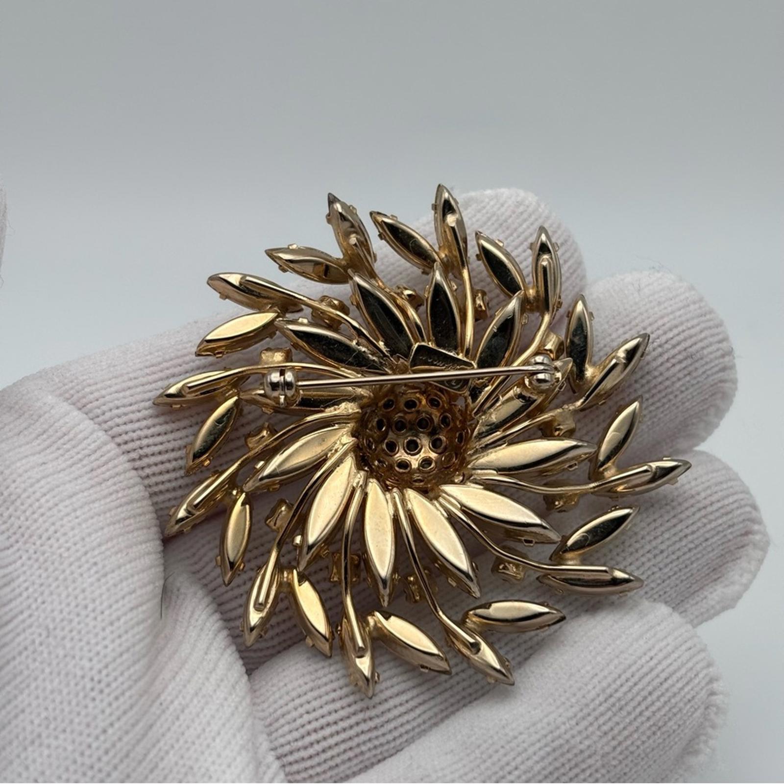 Sherman Aurora Borealis Rhinestone Floral Brooch – Gold Tone