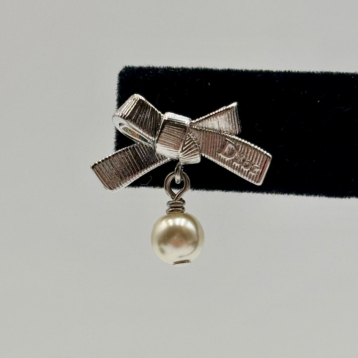 Dior CD Parure Asymmetric Bow Earrings in Silver