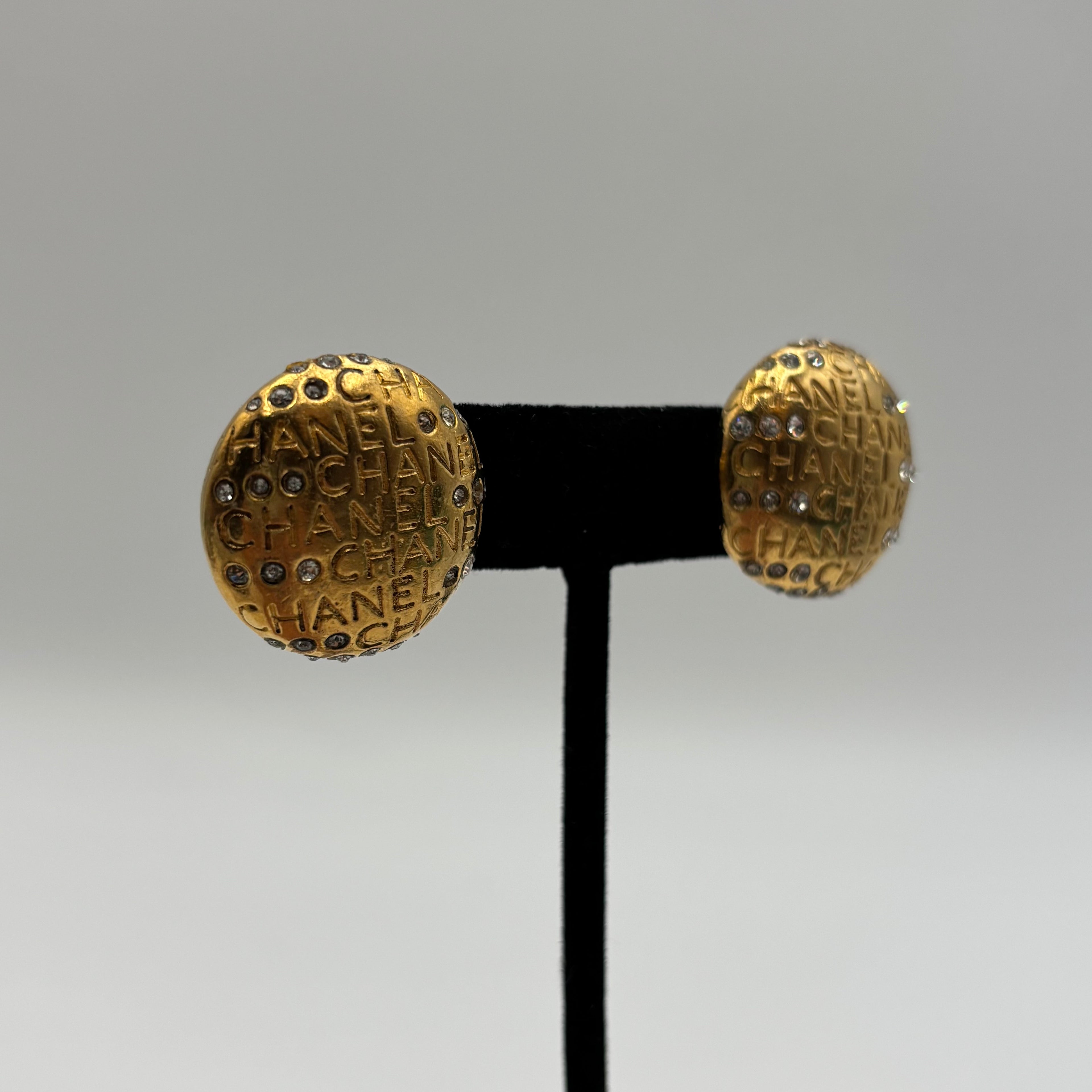 Chanel Gold-Tone Logo Mania Rhinestone Round Clip-On Earrings