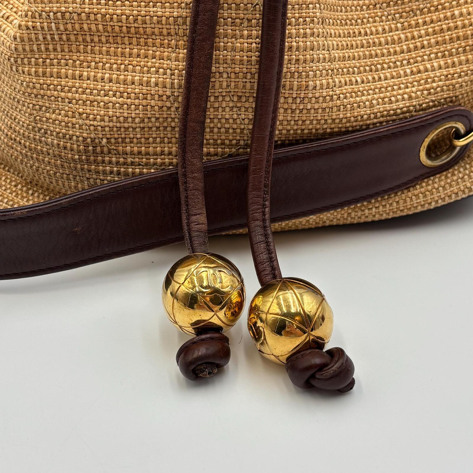 Chanel Raffia Drawstring Bucket Bag With Leather Trim & Gold Hardware