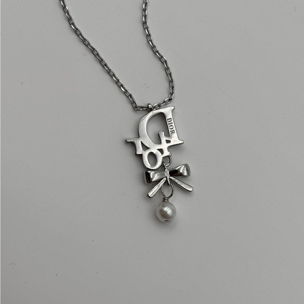 Christian Dior Silver Ribbon Pearl Pendant Necklace
