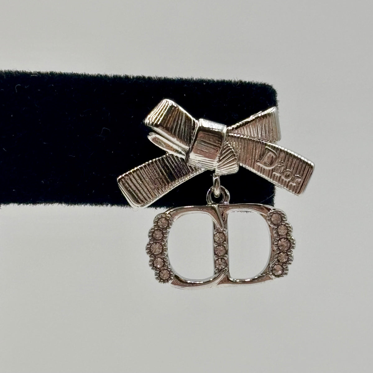 Dior CD Parure Asymmetric Bow Earrings in Silver