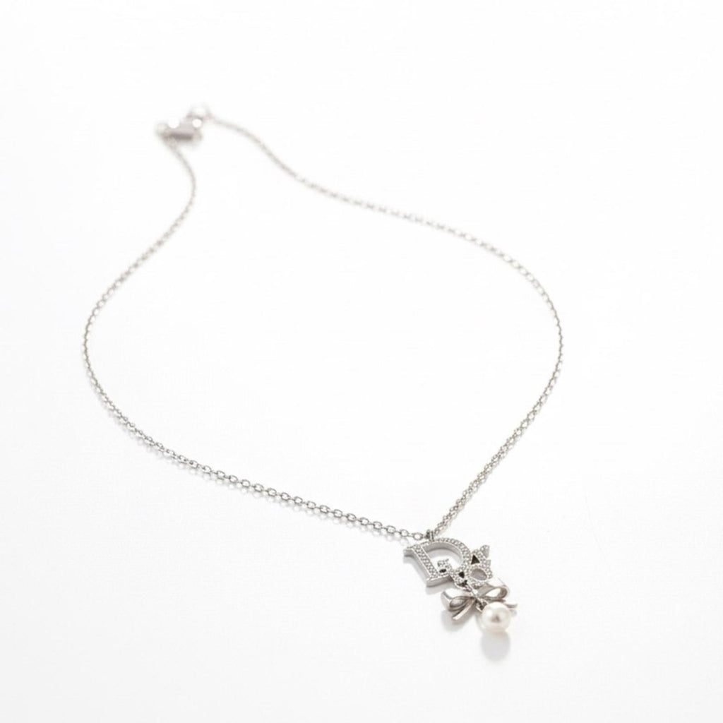 Christian Dior Silver Ribbon Pearl Pendant Necklace