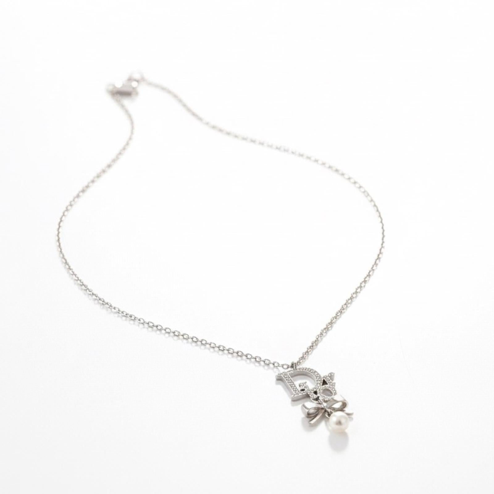 Christian Dior Silver Ribbon Pearl Pendant Necklace