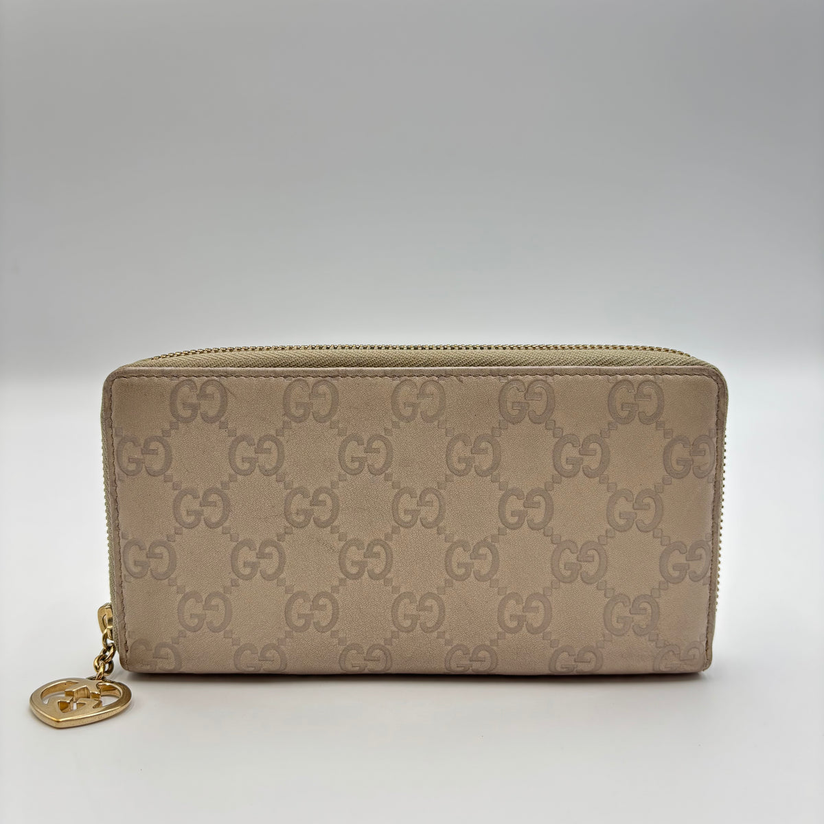 Gucci Guccissima Beige Leather Zip Around Wallet with Gold GG Heart Charm