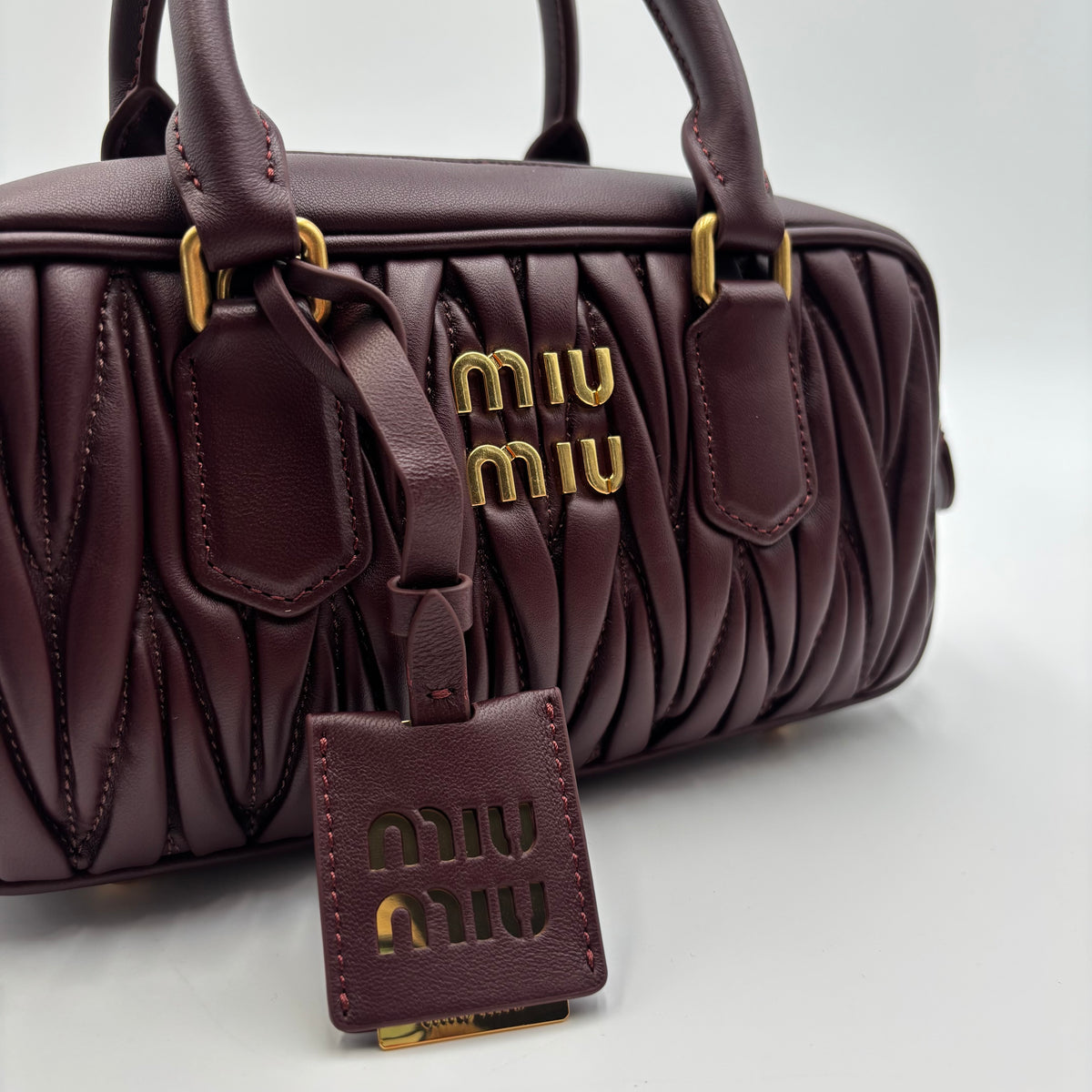 Miu Miu Arcadie Burgundy Matelassé Leather Top Handle Boston Bag With Strap