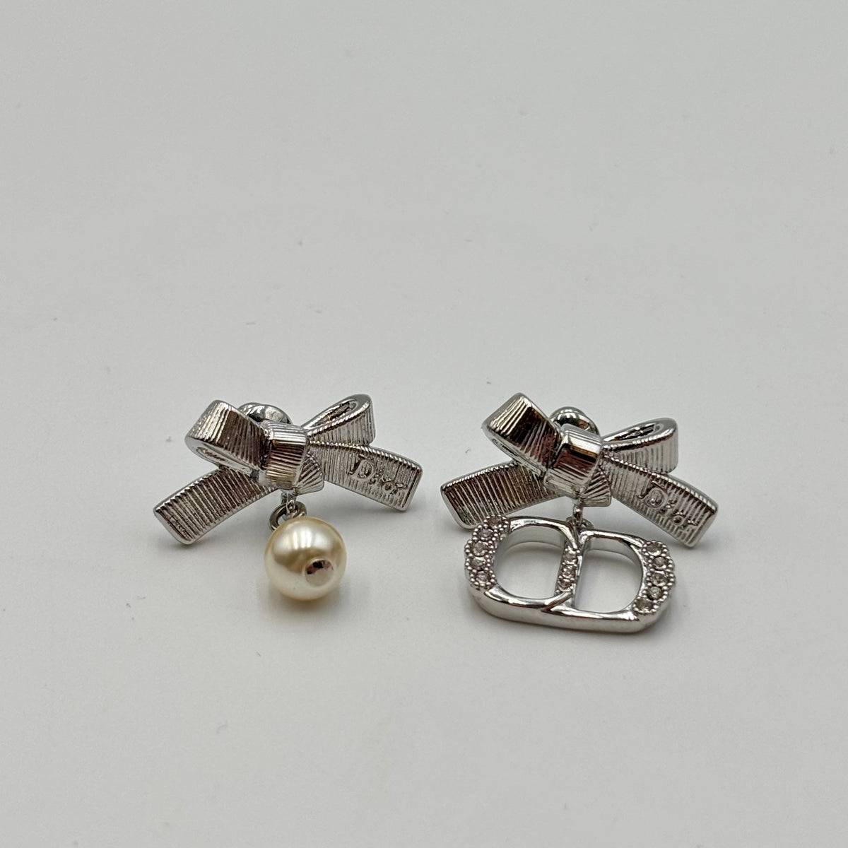 Dior CD Parure Asymmetric Bow Earrings in Silver
