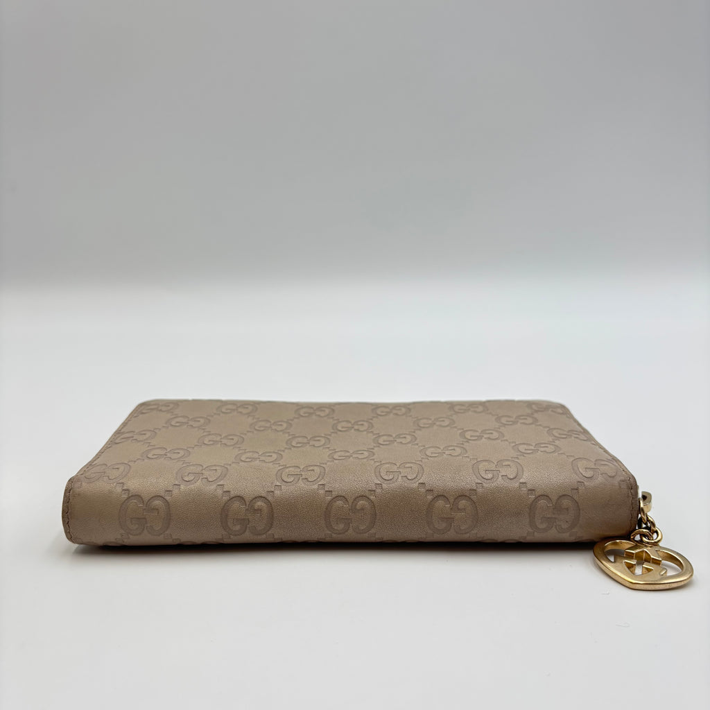 Gucci Guccissima Beige Leather Zip Around Wallet with Gold GG Heart Charm
