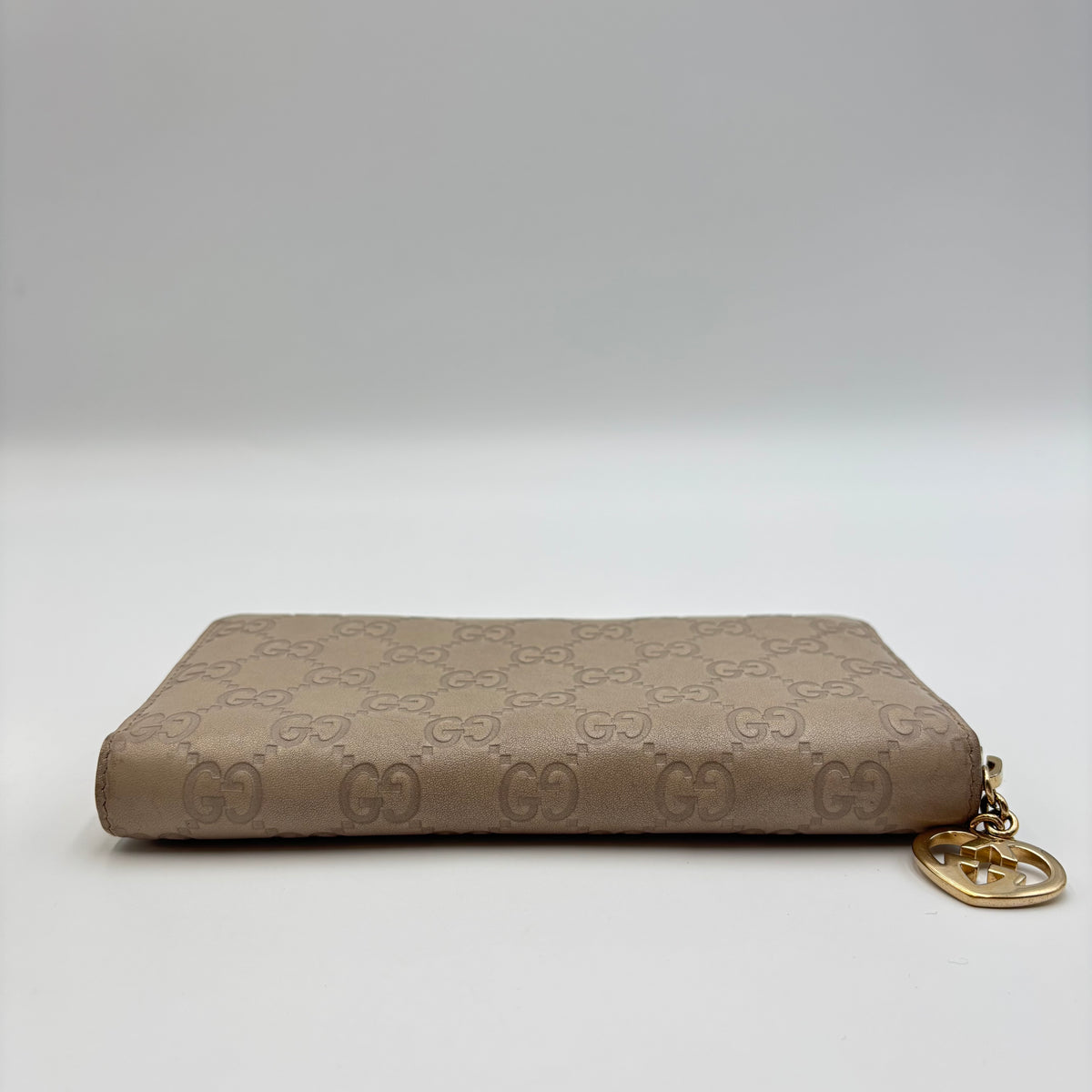 Gucci Guccissima Beige Leather Zip Around Wallet with Gold GG Heart Charm