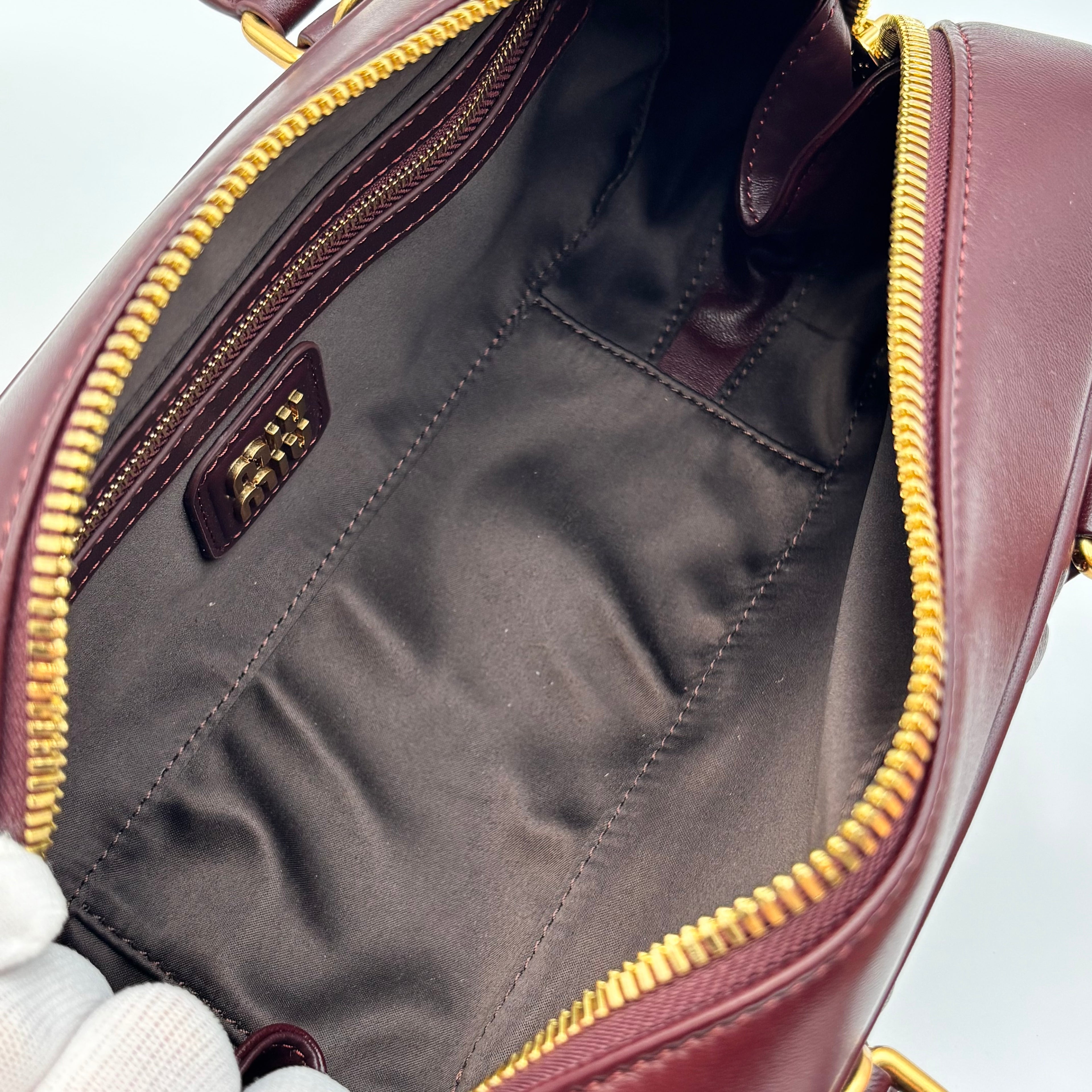 Miu Miu Arcadie Burgundy Matelassé Leather Top Handle Boston Bag With Strap