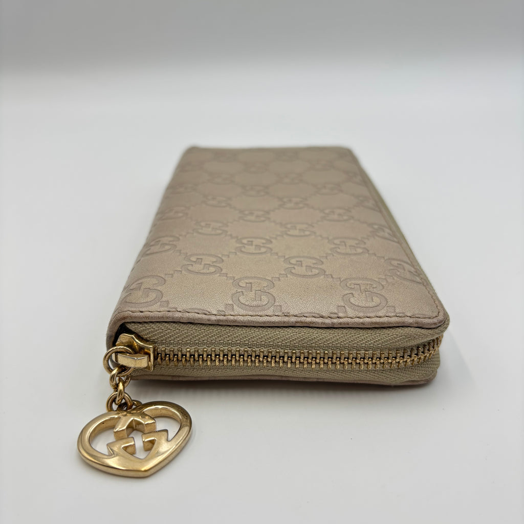 Gucci Guccissima Beige Leather Zip Around Wallet with Gold GG Heart Charm