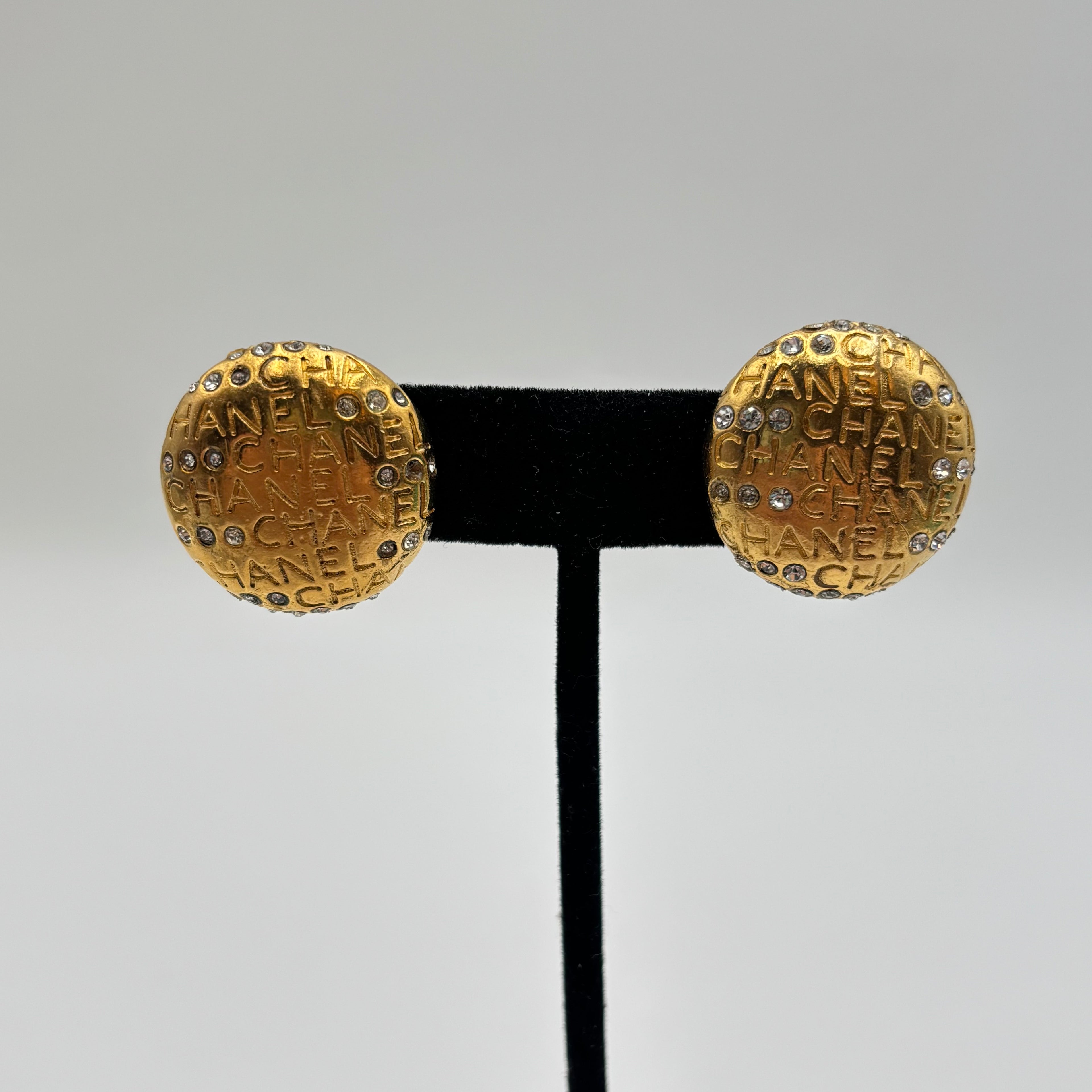 Chanel Gold-Tone Logo Mania Rhinestone Round Clip-On Earrings