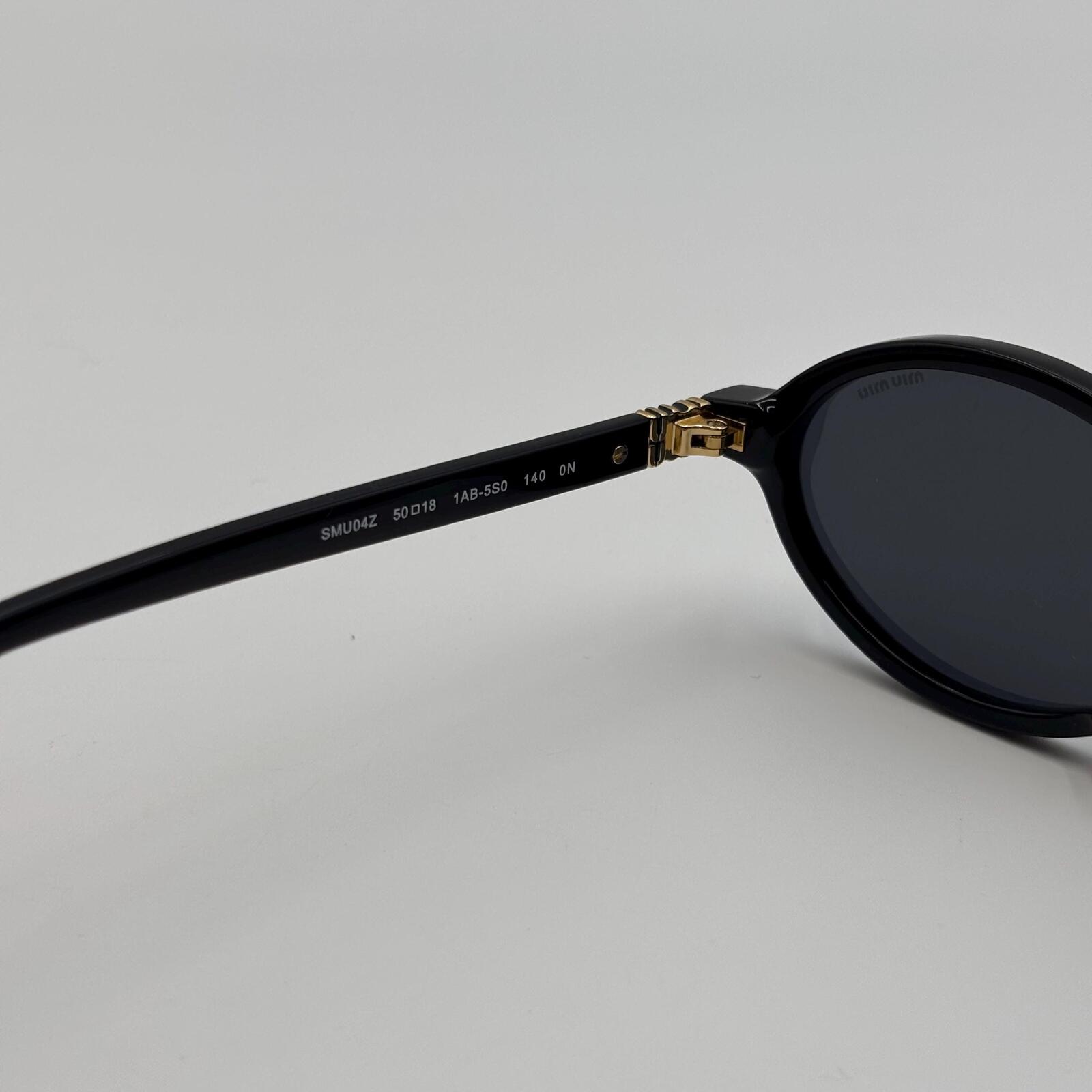 Miu Miu SMU04Z Black Oval Sunglasses