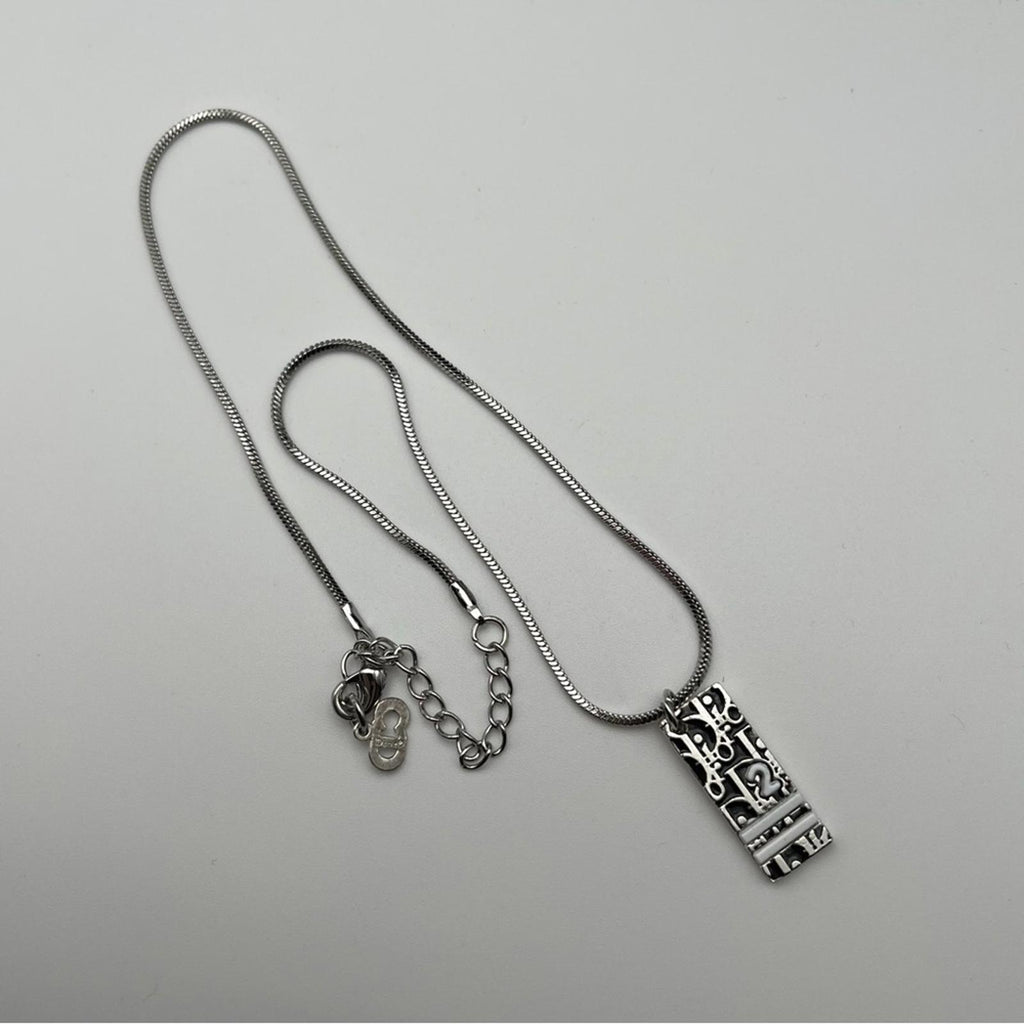 CHRISTIAN DIOR VINTAGE SILVER-TONE OBLIQUE / TROTTER PENDANT NECKLACE