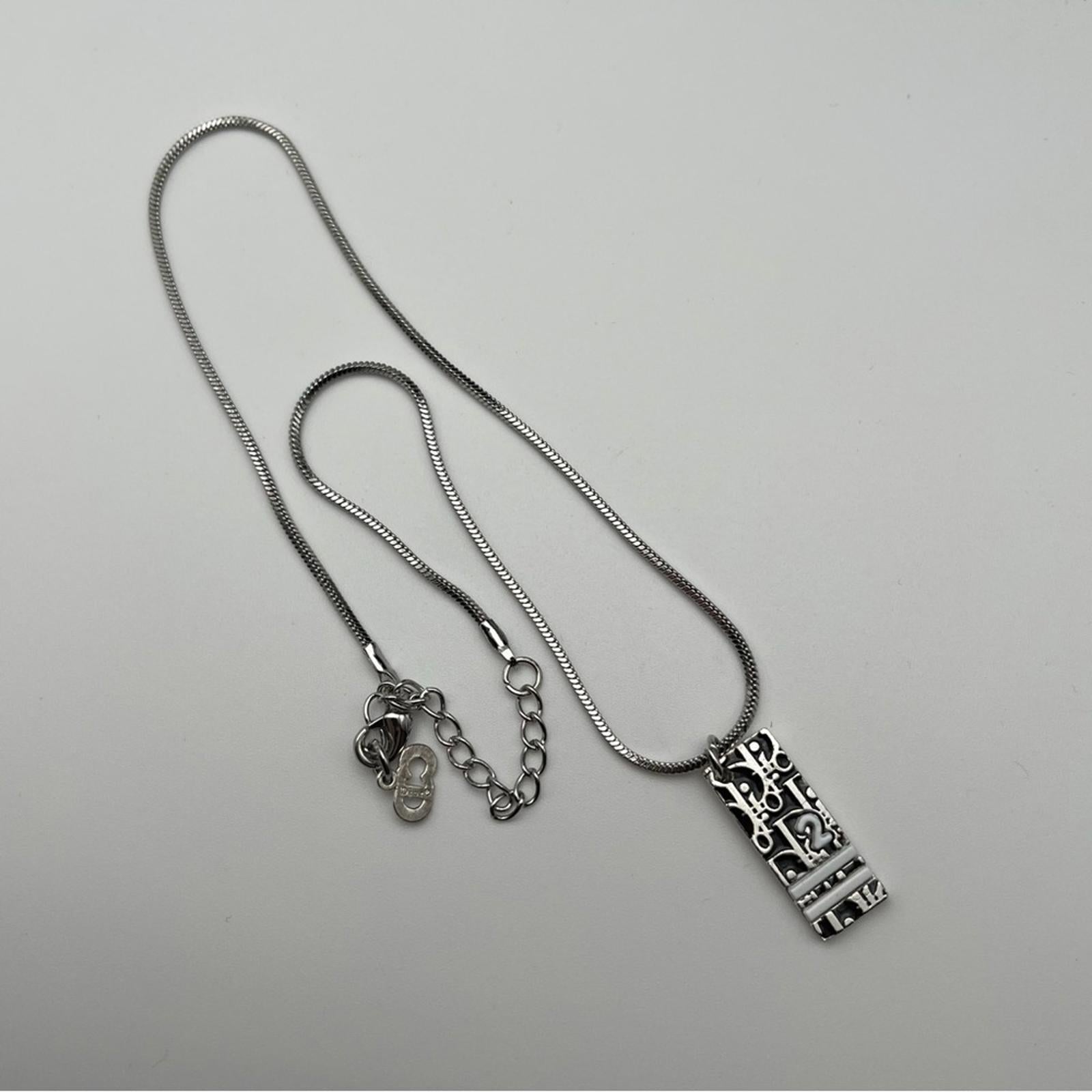 CHRISTIAN DIOR VINTAGE SILVER-TONE OBLIQUE / TROTTER PENDANT NECKLACE