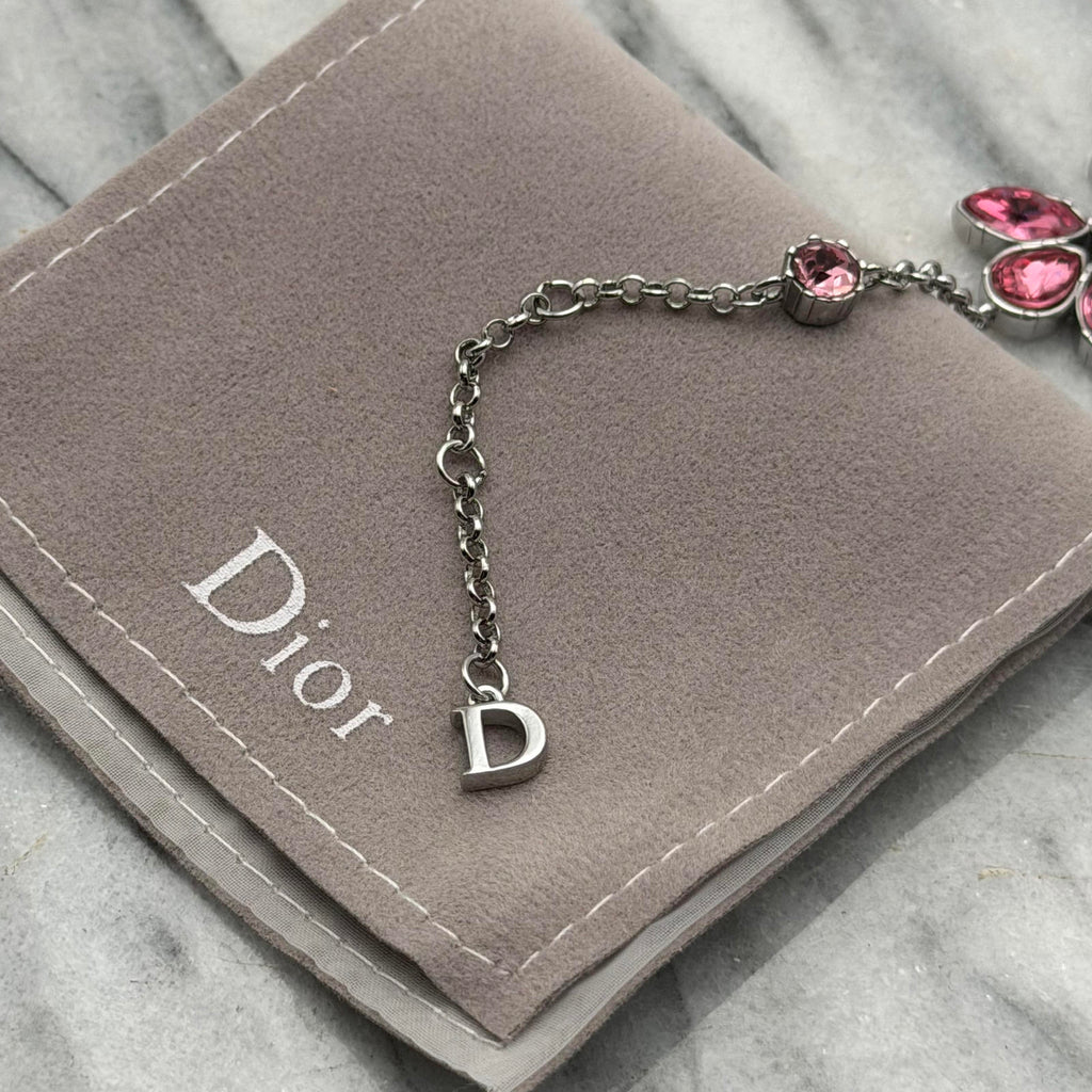 CHRISTIAN DIOR PINK CRYSTAL LOGO BUTTERFLY BRACELET