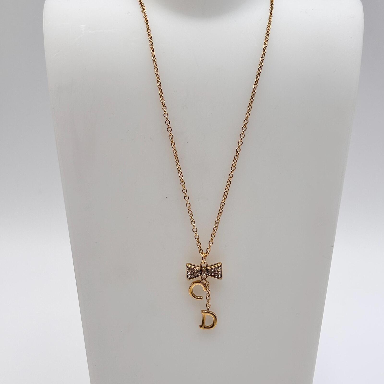 Christian Dior Gold Tone CD Bow Pendant Necklace