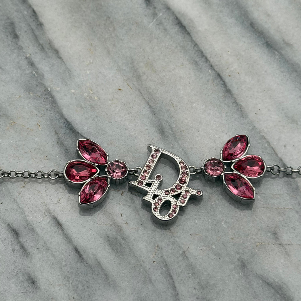 CHRISTIAN DIOR PINK CRYSTAL LOGO BUTTERFLY BRACELET