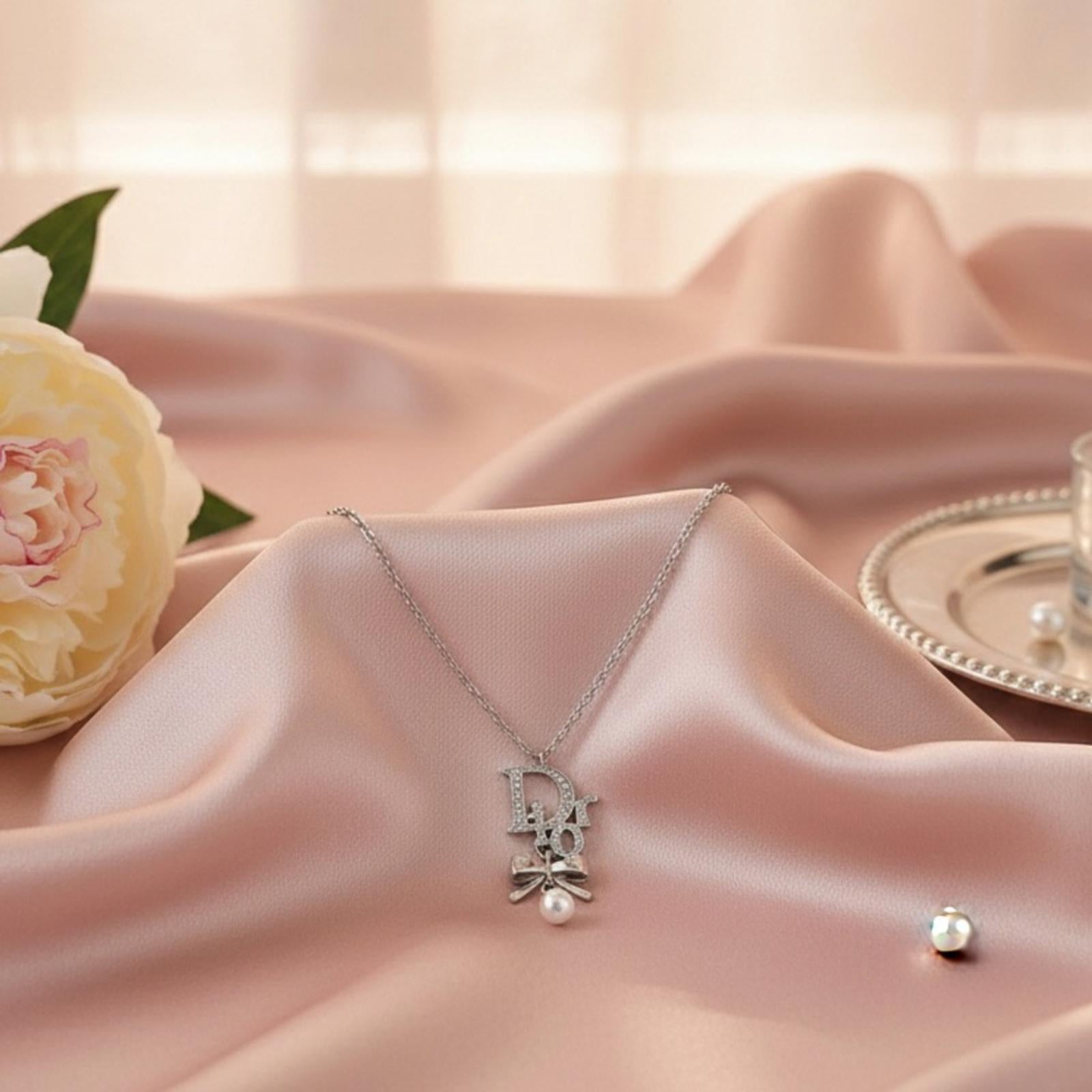 Christian Dior Silver Ribbon Pearl Pendant Necklace